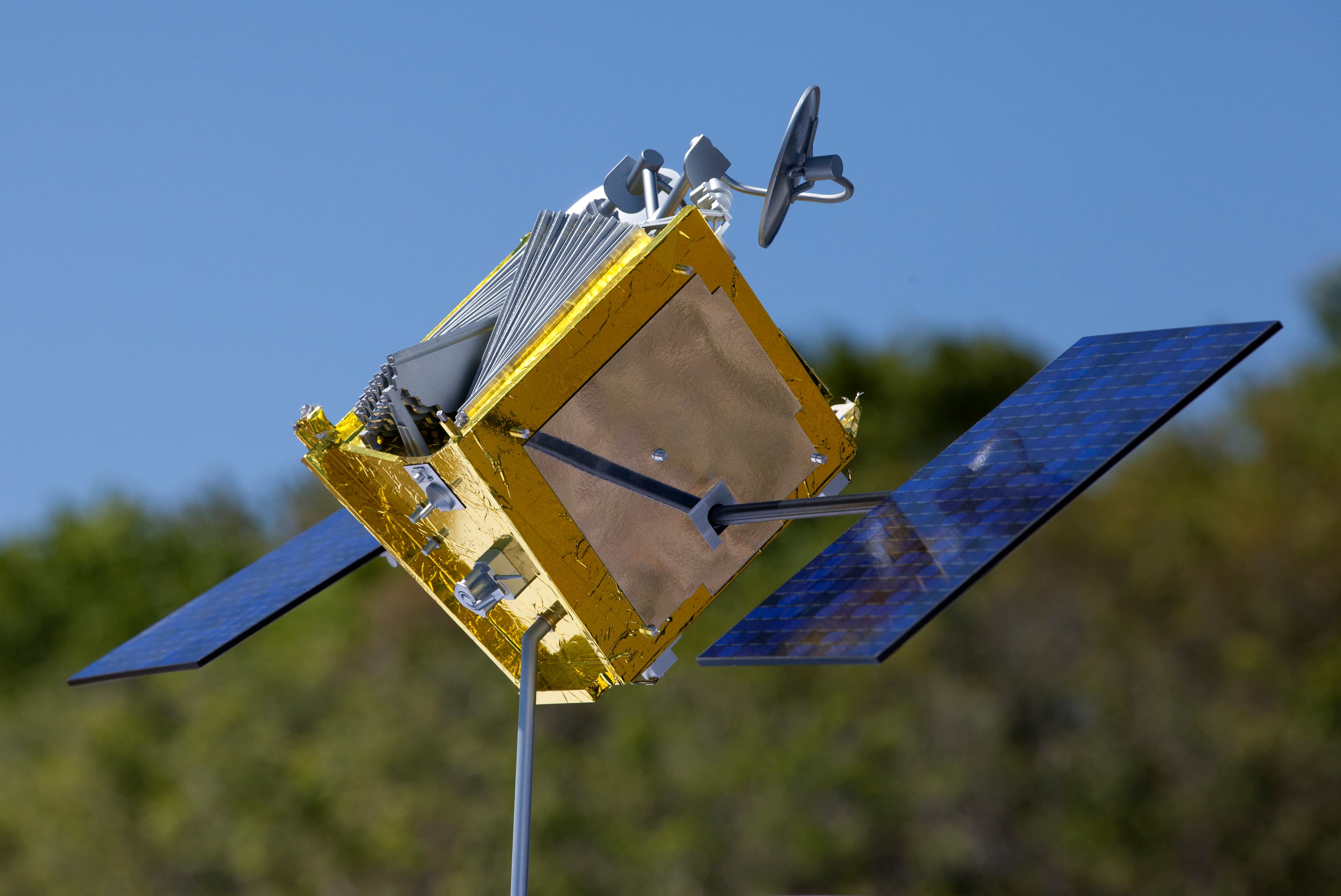 Low Earth orbit communications satellite with deployed solar panels